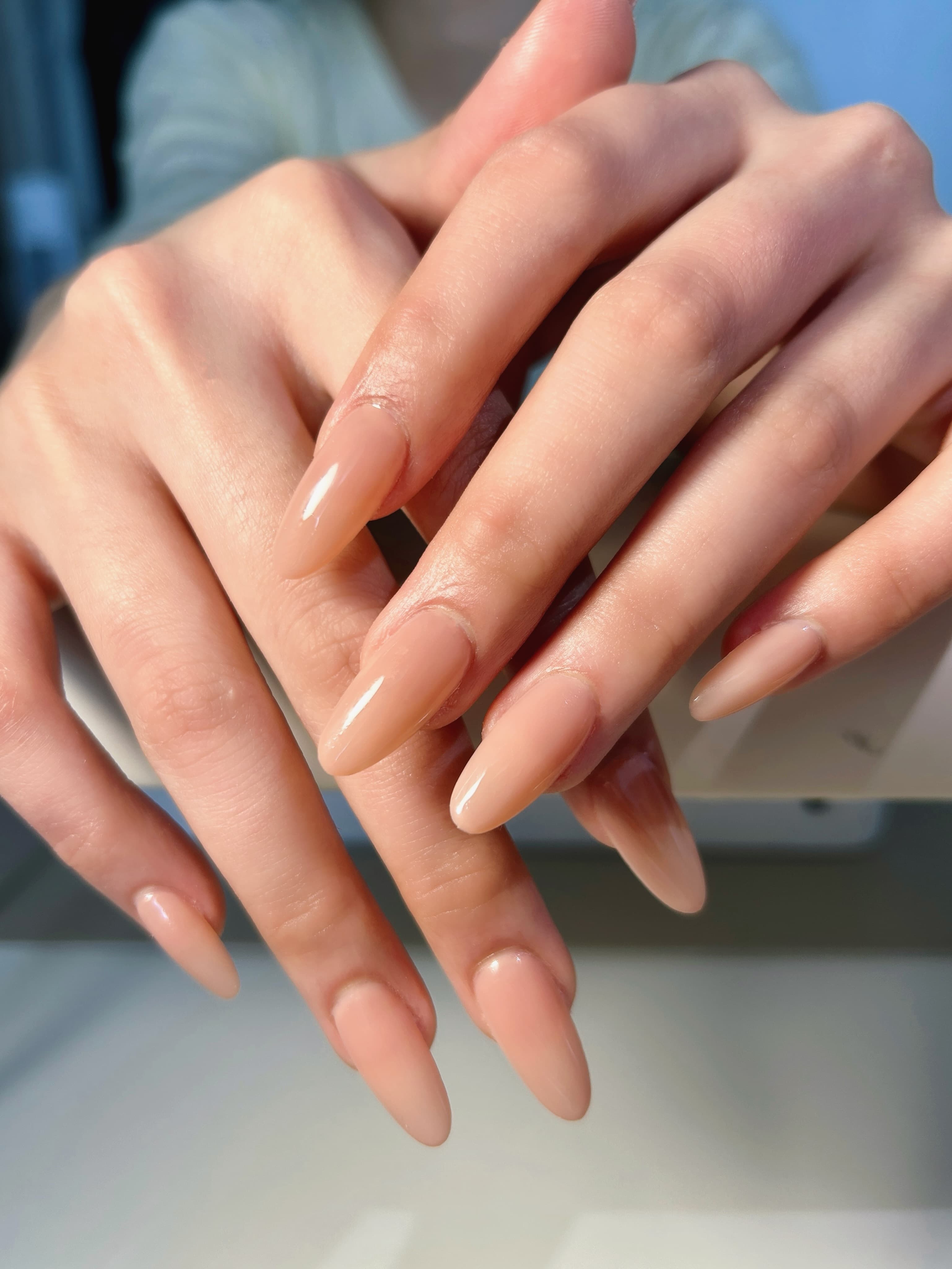 GiGi Nails Vantaa — nude almond-shaped gel manicure
