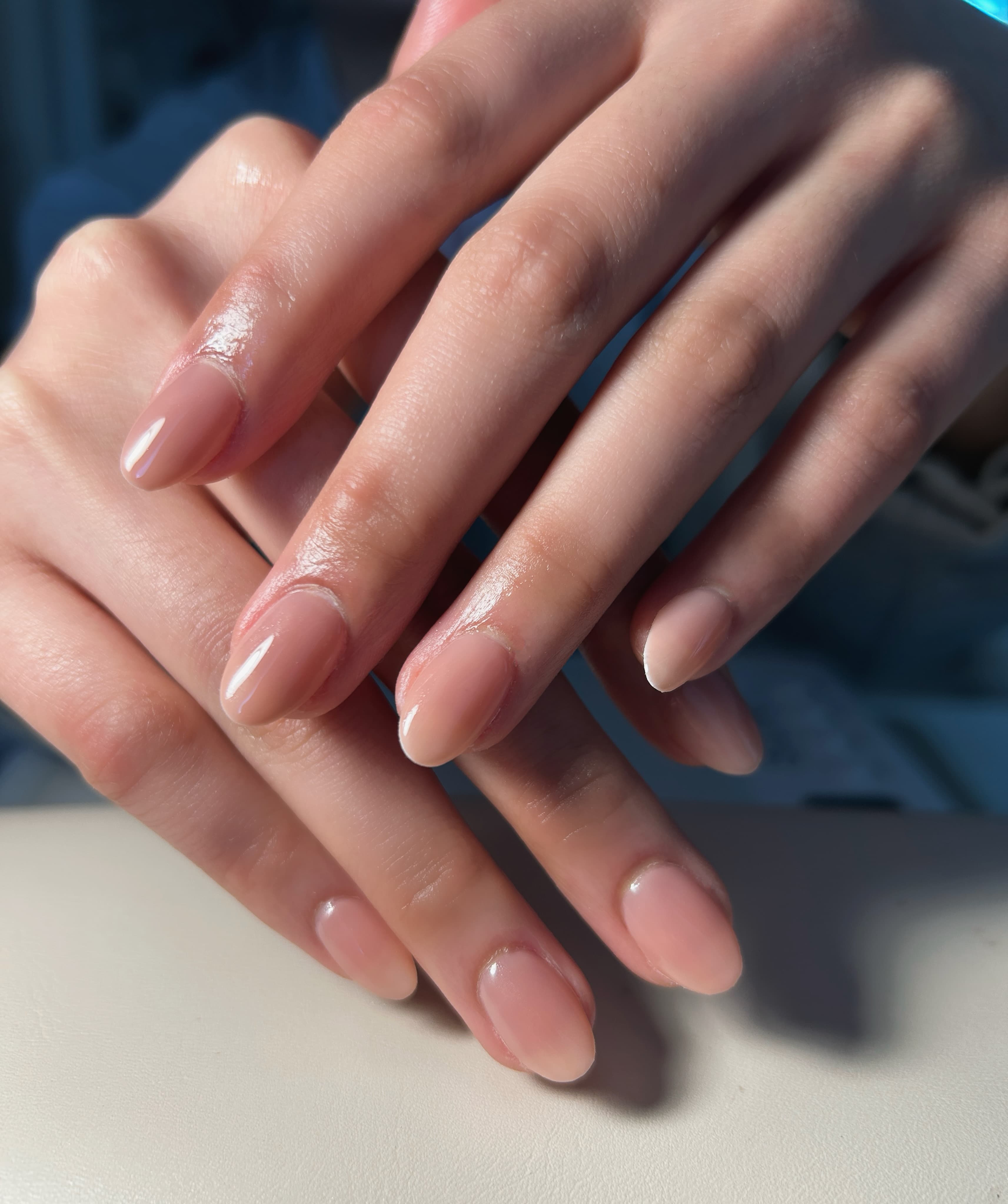 GiGi Nails Vantaa — nude glossy gel manicure finish